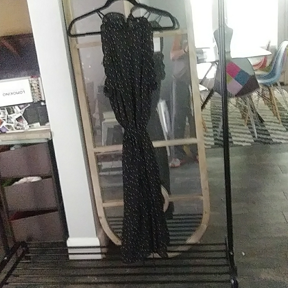 Polka dot dress with ruffles around the arm holes.